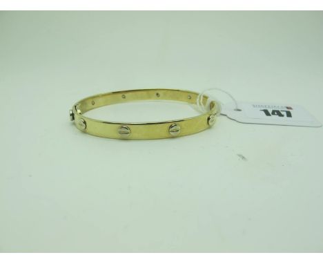 A Modern Hinged Bangle, with inset highlight and screw fastening, stamped "375", internal diameter 6cm (20grams). 