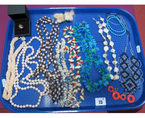 Vintage Seed and Shell Necklaces, a blue and green plastic leaf necklace, butterfly brooch, dress ring, etc :- One Tray 