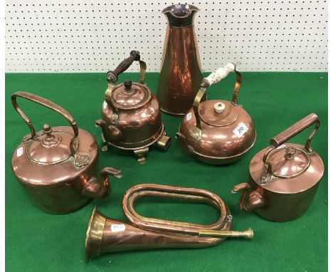 Four various copper kettles, a copper conical jug by Joseph Sankey & Sons, a brass mounted copper bugle, a pair of wooden can