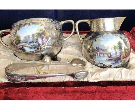 A Victorian silver gilt and enamel decorated cream jug and sugar basin of globular form raised on three ball feet each with w