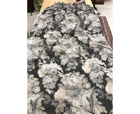 A pair of linen type foliate decorated black, grey and beige interlined curtains with taped pencil pleat headings 300 cm drop