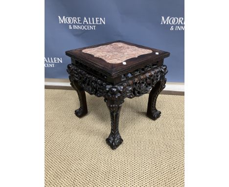 A 19th Century Chinese rosewood urn stand, the square top with rosso marble centre within a moulded and carved edge over a pi