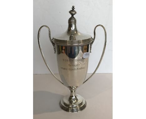 A George V silver two-handled trophy cup and cover, the main body inscribed “The Bobby Gibbs Tetbury Young Conservative”, ins