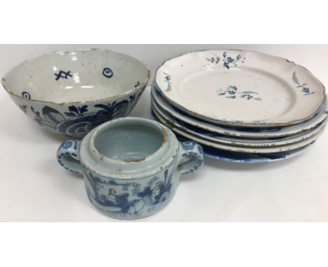 A set of three 19th Century Dutch Delft blue and white floral and foliate decorated shallow bowls 23 cm diameter, an 18th Cen