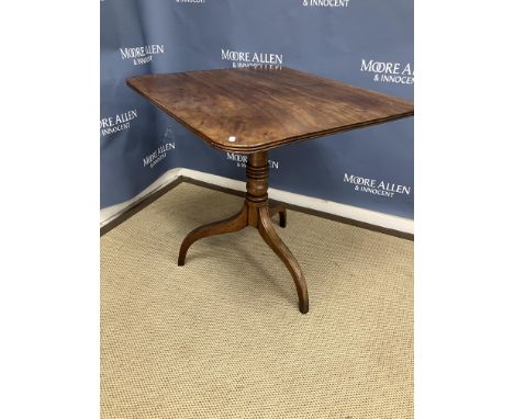 A 19th Century mahogany tea table, the rounded rectangular top on a turned and ringed pedestal to splayed tripod square taper