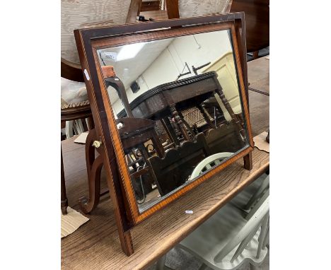 A 19th Century mahogany and satinwood banded, ebony and satinwood strung dressing mirror, the rectangular plate on a sloping 