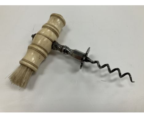 A 19th Century Henshall type bone handled steel corkscrew with brush 14 cm long x 10.5 cm wide