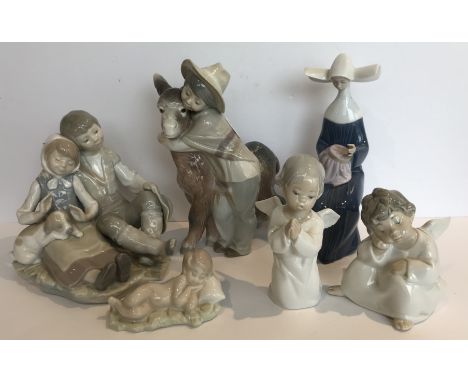 A collection of six Lladro figures and figure groups including young couple seated with puppy, young boy with donkey, nun emb