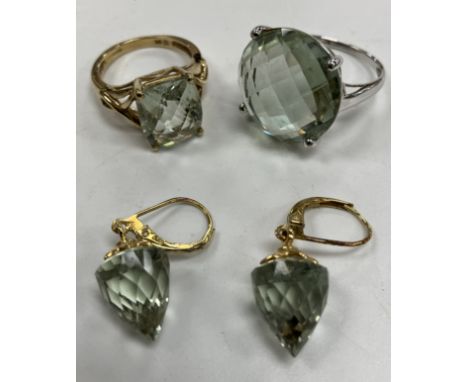 A 9 carat white gold and green quartz set dress ring size O, 5.6 g together with a 9 carat gold and green quartz set pale gre