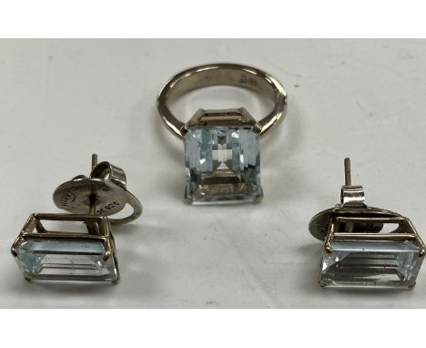 An 18 carat white gold and aquamarine dress ring size K, the rectangular stepped stone approx. 1.2 cm x 1 cm together with a 