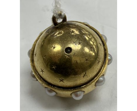 A late Victorian yellow metal and seed pearl mounted celestial globe pendant set with stanhope depicting eight family portrai