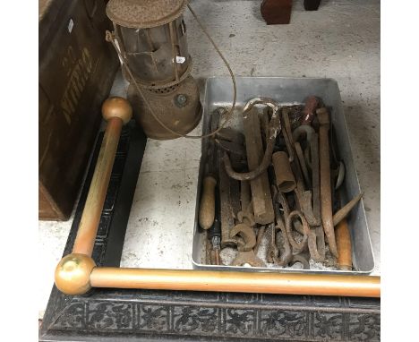A collection of various hand tools to include chisels, hammers, shears, hooks, etc., together with a Victorian cast iron fire