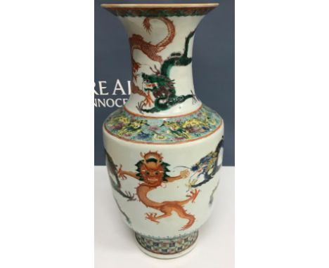 A 19th Century Chinese Guang Xu famille verte vase with flared rim, the main body and neck decorated with four-toed dragons i