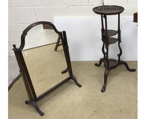 An early 20th Century carved walnut framed dressing mirror in the early 18th Century manner, on cabriole legs to lion's paw f