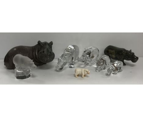 A collection of decorative hippos to include two Baccarat glass models, an Orrefors model, a Villeroy & Boch figure and a Goe