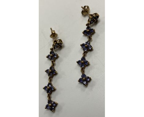 A pair of 9 carat gold Iolite (cordierite/water sapphire) mounted drop earrings of flower head form 4.2 g over all together w