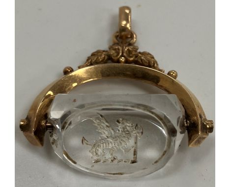 A 19th Century yellow metal mounted rock crystal seal decorated to one side with dragon and axe, the other two blank, 3.2 cm 