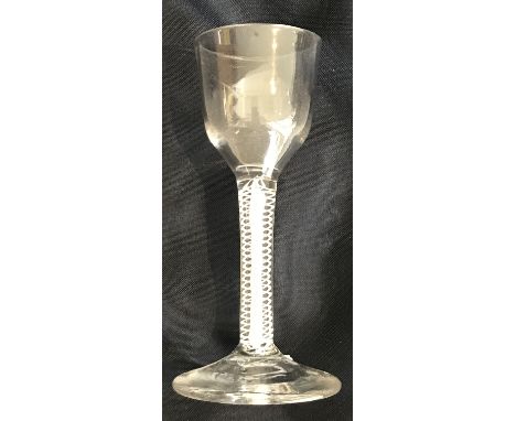 An 18th Century wine glass, the bucket shape bowl on a double enamel twist stem to circular foot 13.7 cm high x 5 cm diameter