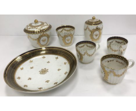 A Worcester Salopian blue and gilt decorated ribbed sugar box, cream jug, slop bowl, three tea cups, five saucers, two shallo