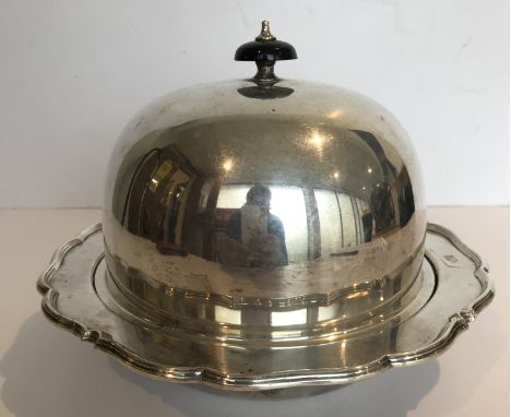 A George V silver muffin dish of typical form with ebony finial to the cover, with liner (by George Howson for Harrison Broth