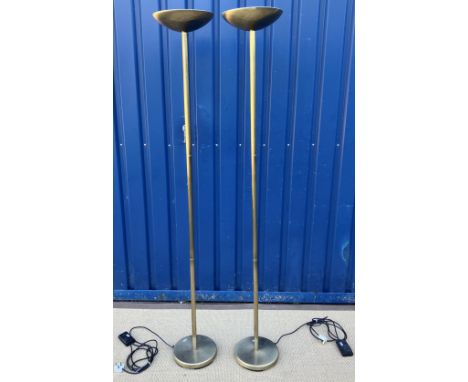 A pair of modern "search light" anodised brass effect uplighters with dished tops on plain cylindrical stands to circular foo