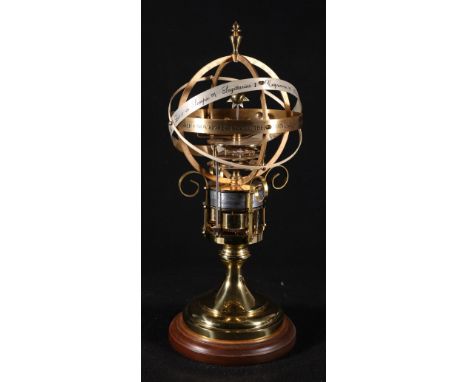 St James Clock Company lacquered brown astrolabe, on mahogany plinth, 42cm. CONDITION REPORT: When wound appears to go  altho