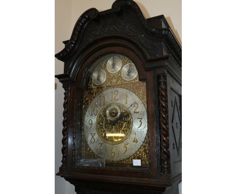 Winterhalder and Hoffmeier carved oak longcase clock, the arched dial with silvered Arabic chapter, seconds, strike / silent,