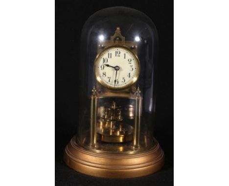 BHA brass anniversary clock, on a gilt metal plinth with dome.