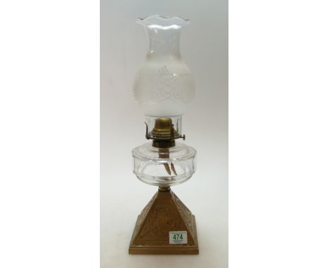 20th century oil lamp with owl motif to base