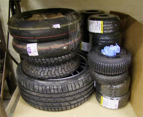 A section of tyres including Dunlop also an alloy wheel etc......This lot is either a catalog return, unclaimed good or a dis