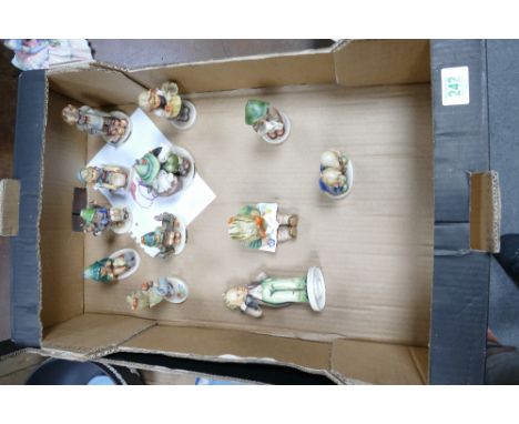 A collection of Goebel Hummel figures to include Boy with Doll, with bunnies, with lamb, with birds , girl reading etc (12)