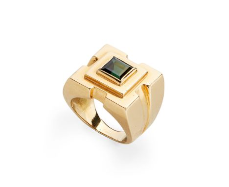 collet set with a square step-cut green tourmaline, in a bold angular surround, signed and stamped 750(Ring size: K/L)
