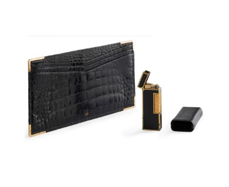 the alligator skin note wallet with 9ct gold mounts to corners, stamped Dunhill London; with a black enamelled gentleman's Du