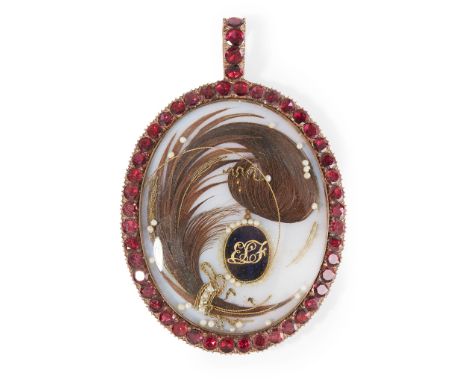 of oval outline, the central hair motif with seed pearl and enamel panel detail, the whole in a border of round-cut garnets, 