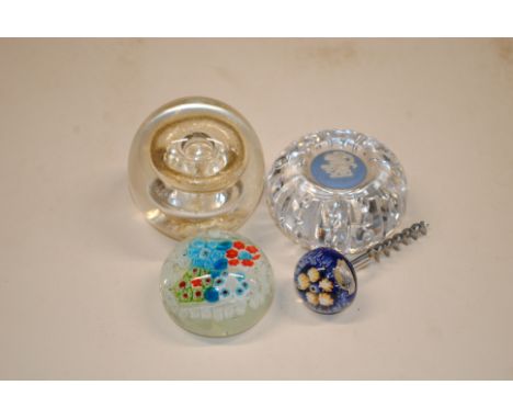 Three glass paperweights and a corkscrew with millefiori type handle 