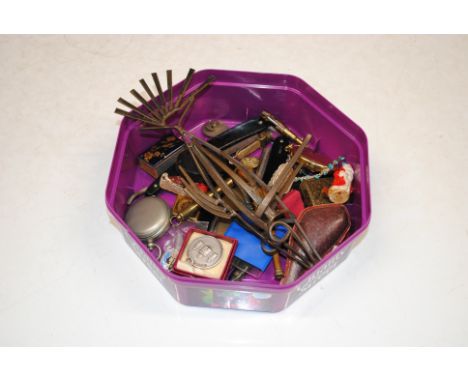 A box of mixed items to include enamel decorated badges; cut throat razors, a masonic medal; a compass etc.