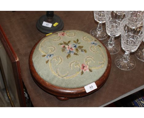 A 19th Century needlework footstool 