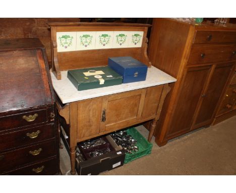 A marble topped and tile back washstand