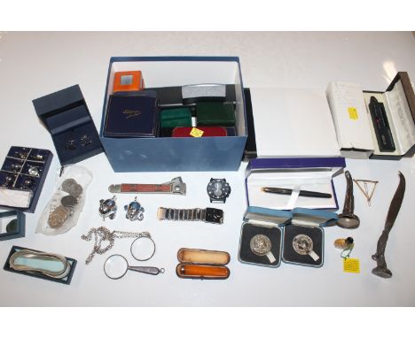 A box containing a cased amber cheroot holder, novelty name place holders, pewter handled cheese knife, section of a white me