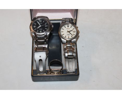 A titanium ring, a Seiko Kinetic wrist watch and a Citizen Eco Drive titanium wrist watch