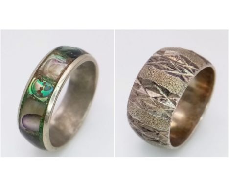 A vintage sterling silver engraved band ring with size M/N and a silver Mother of pearl ring with size M. Total weight 8.5G. 