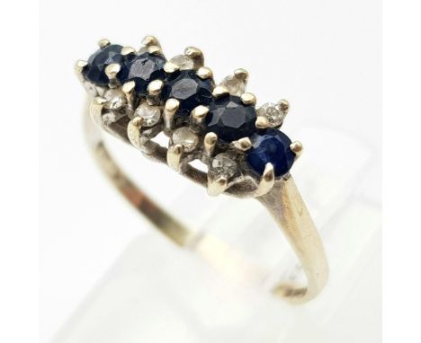 A Vintage 9K Yellow Gold Diamond and Sapphire Ring. Four sapphires and eight small diamonds. Size K. 2.2g total weight. 