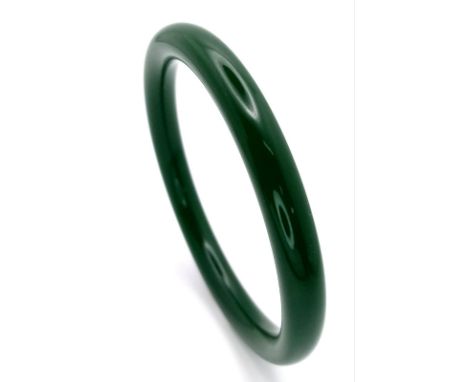 A Thin Chinese Dark Green Jade Bangle. 7mm width. 6cm inner diameter. 