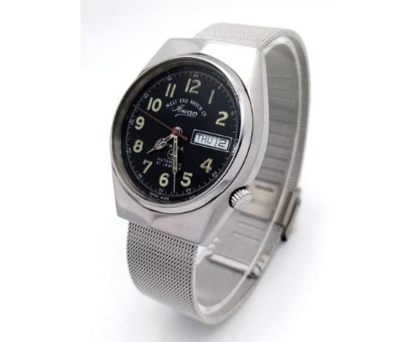 A Vintage West End Watch Company Prima Gents Watch. 21 jewels. Stainless steel bracelet and case - 36mm. Black dial with day/