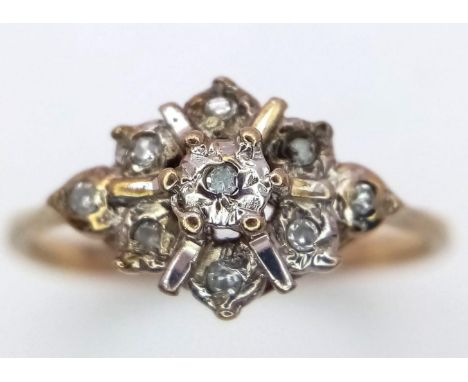 A Vintage 9K Yellow Gold Diamond Cluster Ting. Size H. 1.05g weight. 
