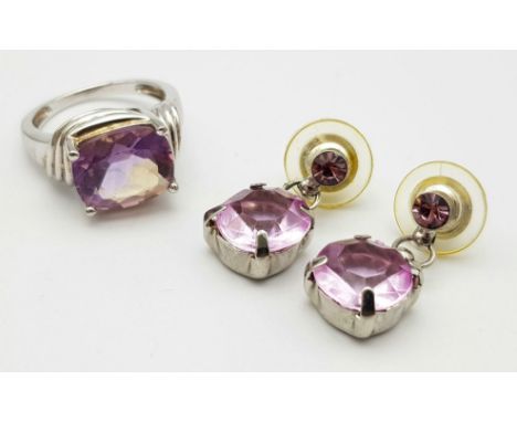 A matching set of Purple stone jewellery include a pair of drop earrings and a solitaire ring. 