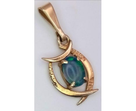 A 9K Yellow Gold Opal Pendant. Nice colour-play. 2.5cm. 10.8g weight. 