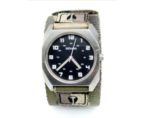 A Men’s Nixon Military Watch. 38mm Including Crown on Camouflage Combat Strap. Scout Model. Full Working Order.
