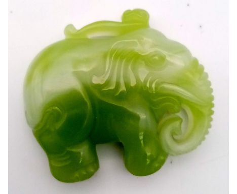 A Chinese Green and White Jade Elephant Pendant. 5 x 4.5cm. 