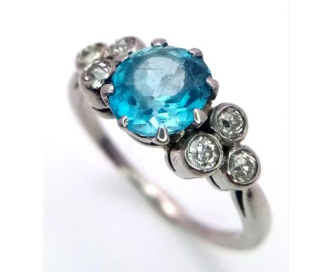 A 9K WHITE GOLD PALLADIUM DIAMOND AND BLUE TOPAZ RING  .   3.2gms   size N 